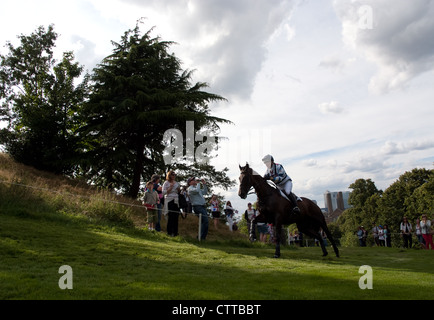 Team GB rider Kristina Cook riding Miners frolic take on a steep climb during the Cross country event at Greenwich park London Stock Photo