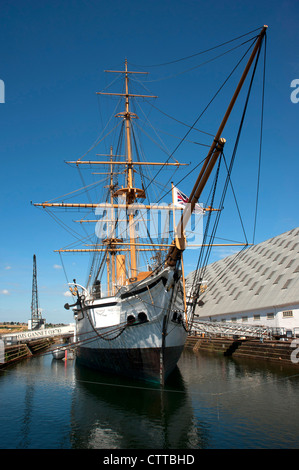 HMS GANNET. Historic ironclad Victorian sailing sloop at Chatham historic dockyard, Kent, England.  Blue cloudless sky Stock Photo