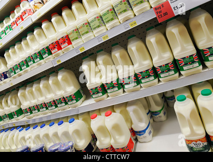 Milk on the Shelves of a Supermarket Aisle, UK. Stock Photo