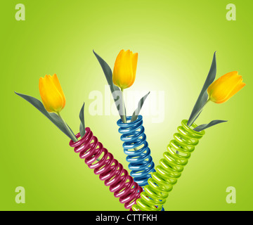 green metal spring with yellow tulip. Stock Photo