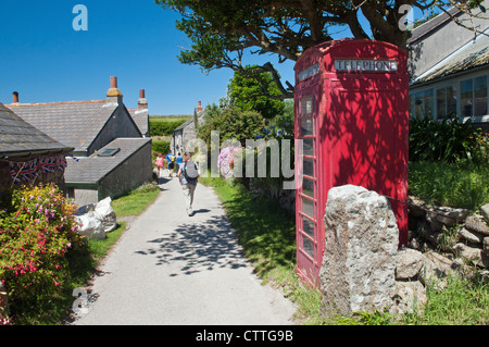 Narrow lane through Middle Town, one of three villages on St Martins on the Isles of Scilly Stock Photo