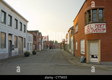 Abandoned village located between the harbors (Port of Antwerp) and nuclear reactor of Antwerp, Belgium Stock Photo
