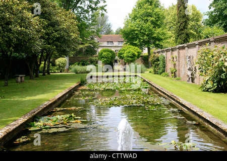 The Long Pond in the walled gardens of Athelhampton House Dorset Stock Photo