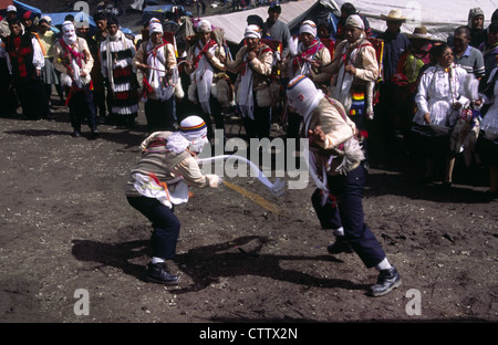 Pilgrims engaged in a whipping-match during Qoyllur Ritti Pilgrimage. Ocongate, Cuzco Department, Peru. Stock Photo