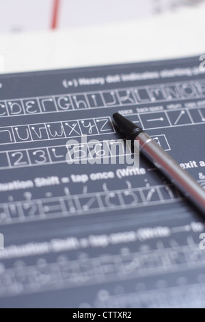 pda stylus on handwriting guide Stock Photo