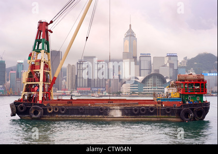 Barge in front of business district in Hong Kong. Stock Photo