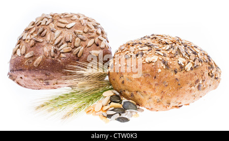 Heap of Rolls with wheat isolated on white background Stock Photo