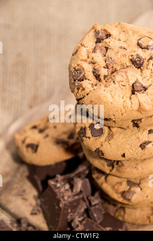 Stacked Cookies with Chocolate on a rustic background Stock Photo