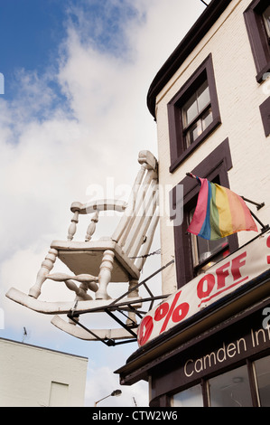 Larger than life model of a wooden rocking-chair above the entrance to a furniture shop on Chalk Farm Road in Camden. Stock Photo