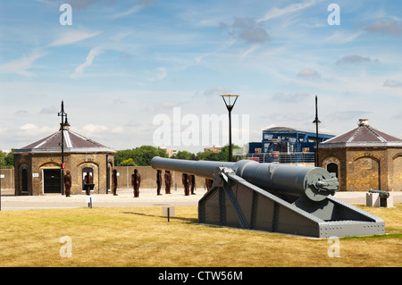 Display of cannons at Royal Arsenal Riverside, with the “Assembly, Edition 1” installation by Peter Burke in the background. Stock Photo