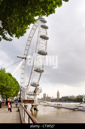 The London Eye on Southbank, with the parliament buildings in the background. Stock Photo