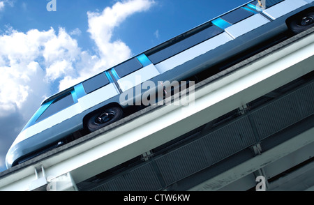 Underside angle of downtown metro rail train car against bright blue sunny sky. Stock Photo