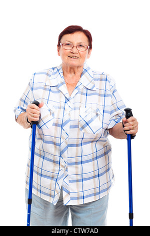 Portrait of happy smiling senior woman with walking sticks, isolated on white background. Stock Photo