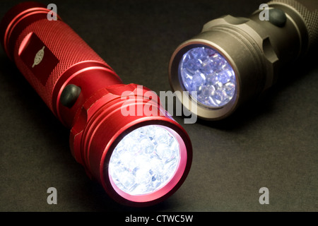 Two Modern LED Flashlights - Turned On (LED stands for Light Emitting Diode) Stock Photo
