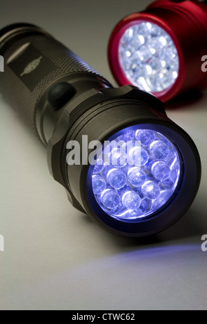 Two Modern LED Flashlights - Turned On (LED stands for Light Emitting Diode) Stock Photo