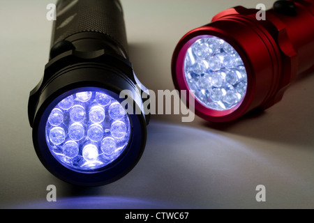 Two Modern LED Flashlights - Turned On (LED stands for Light Emitting Diode) Stock Photo