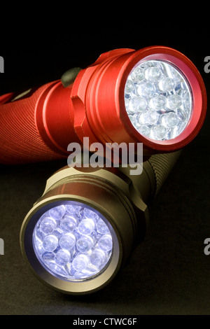 Two Modern LED Flashlights - Turned On (LED stands for Light Emitting Diode) Stock Photo