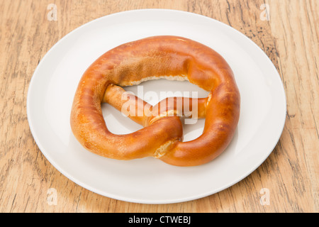 Soft Pretzel on a white plate Stock Photo