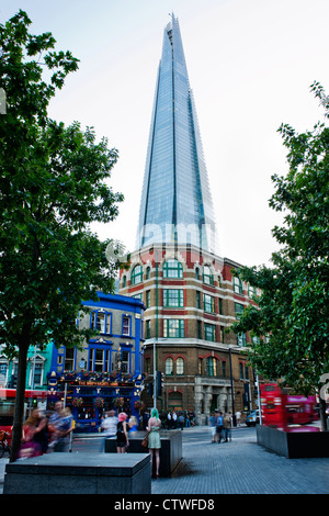 The Shard, Europe's tallest building at 308 meters towers above the Victorian architecture on Tooley Street, London Bridge, Stock Photo