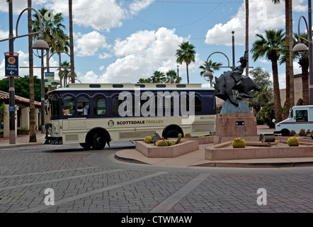 Free Old Town Scottsdale AZ downtown 'hop on hop off' trolley bus service in traffic circle roundabout