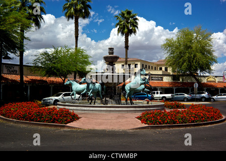 Herd wild horses water fountain art sculpture traffic circle roundabout Old Town Scottsdale AZ Stock Photo