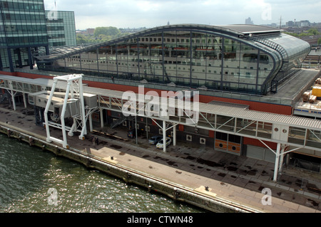 Cruise ship Aurora reflected in the windows of the cruise terminal building in Amsterdam, Netherlands Stock Photo