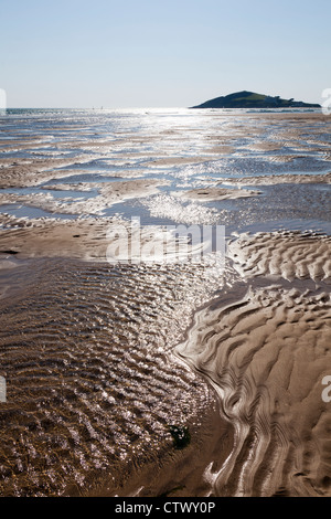 Sand patterns and the incoming tide at Bantham, Devon Stock Photo