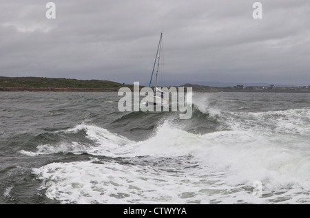 yacht in stormy seas Stock Photo