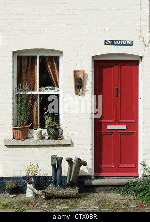 Quirky english colourful red door and house name. The Nutmeg. Eardisland. Herefordshire, England Stock Photo