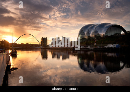 NEWCASTLE, UK - AUGUST 02, 2012:   Dawn on the River Tyne in Newcastle with Millennium Bridge and Sage Building in view. Stock Photo