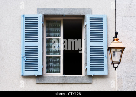 Blue shutters on a French window. Stock Photo