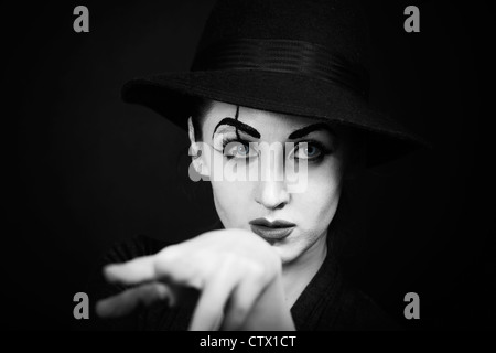 woman mime with theatrical makeup on black background Stock Photo