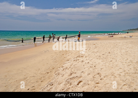 Fishermen pulling in large net (madela), south coast of Sri Lanka Stock Photo