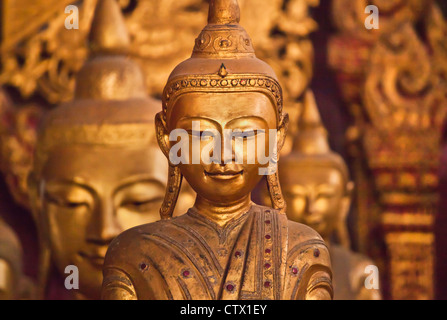 Ancient wooden BUDDHA STATUES in the main chapel of WAT JONG KHAM - KENGTUNG also known as KYAINGTONG, MYANMAR Stock Photo