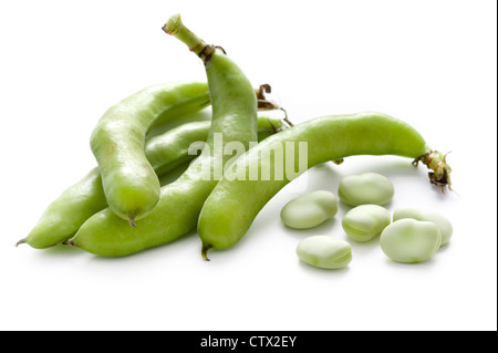 fava beans or broad beans shelled and in pods isolated on a white background Stock Photo