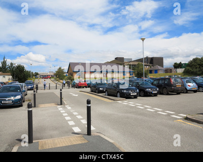 Cars parked in the overflow car park at Ysbyty Gwynedd Hospital in Bangor, Gwynedd, North Wales, UK, Britain Stock Photo