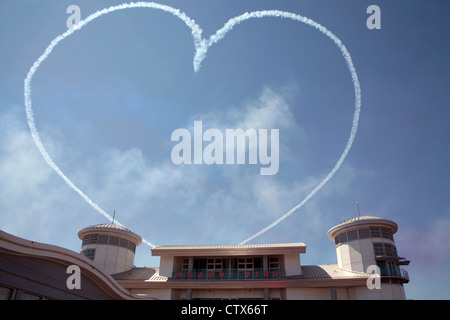 A heart in the sky drawn by the Red Arrows as part of the Grand Pier Air Show Weston Super Mare Somerset UK Stock Photo