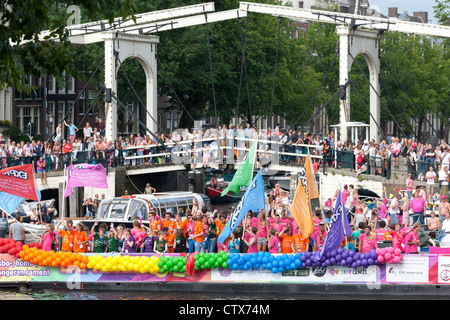 Amsterdam 2012 Gay Pride Canal Parade. Float of gay youth organization Expreszo. Decorated with rainbow colored balloons. Stock Photo