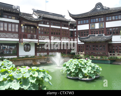 View of traditional looking Chinese buildings and fountain in the Yuyuan Market near the Yuyuan Garden in Shanghai China Stock Photo