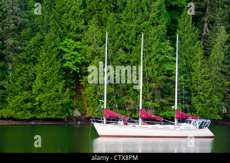 Three masted sailing vessel at anchor in a sheltered inlet, Vancouver Island, British Columbia, Canada Stock Photo