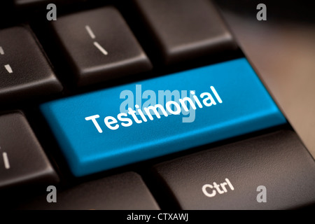 The word Testimonial on return key of keyboard. Stock Photo