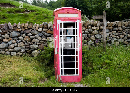 A disused phone box at Brotherilkeld, Cumbria, which is being taken into care by the local community Stock Photo