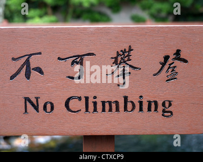 No Climbing sign in both English and Chinese Stock Photo