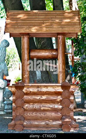Decorative ornament for park - Wooden well Stock Photo