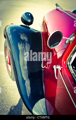 Old car view on the left mirror and headlight Stock Photo