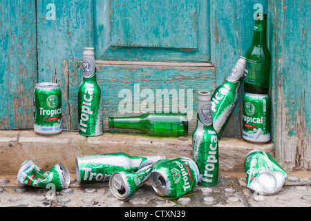 Bottles and cans of Tropical and beer on a doorway during the Bajada de la Rama Fiesta in Gran Canaria. Stock Photo