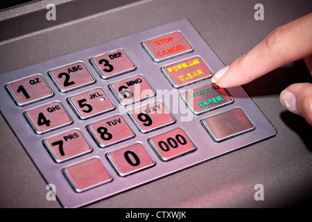 ATM machine keypad numbers. Entering atm cash machine pin code Stock Photo