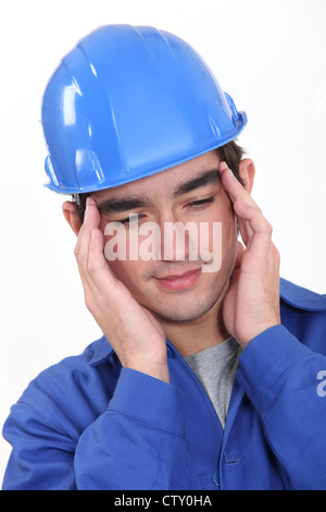 Builder suffering from tension headache Stock Photo