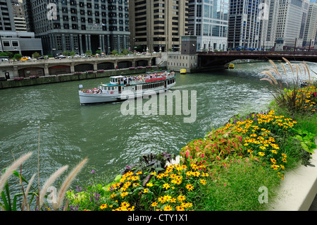 Chicago Architectural tour boat loaded with tourists cruising the Chicago River. Stock Photo