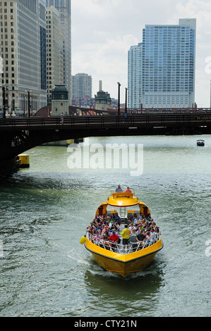 Chicago architectural tour boat loaded with tourists cruising the Chicago River. Stock Photo